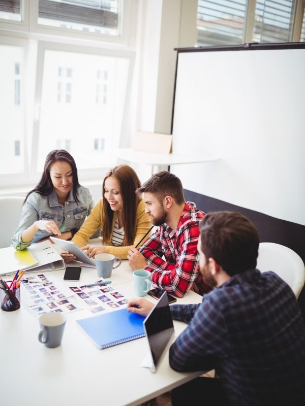 photo-editors-with-digital-tablet-in-meeting-room.jpg photo-editors-with-digital-tablet-in-meeting-room.jpg